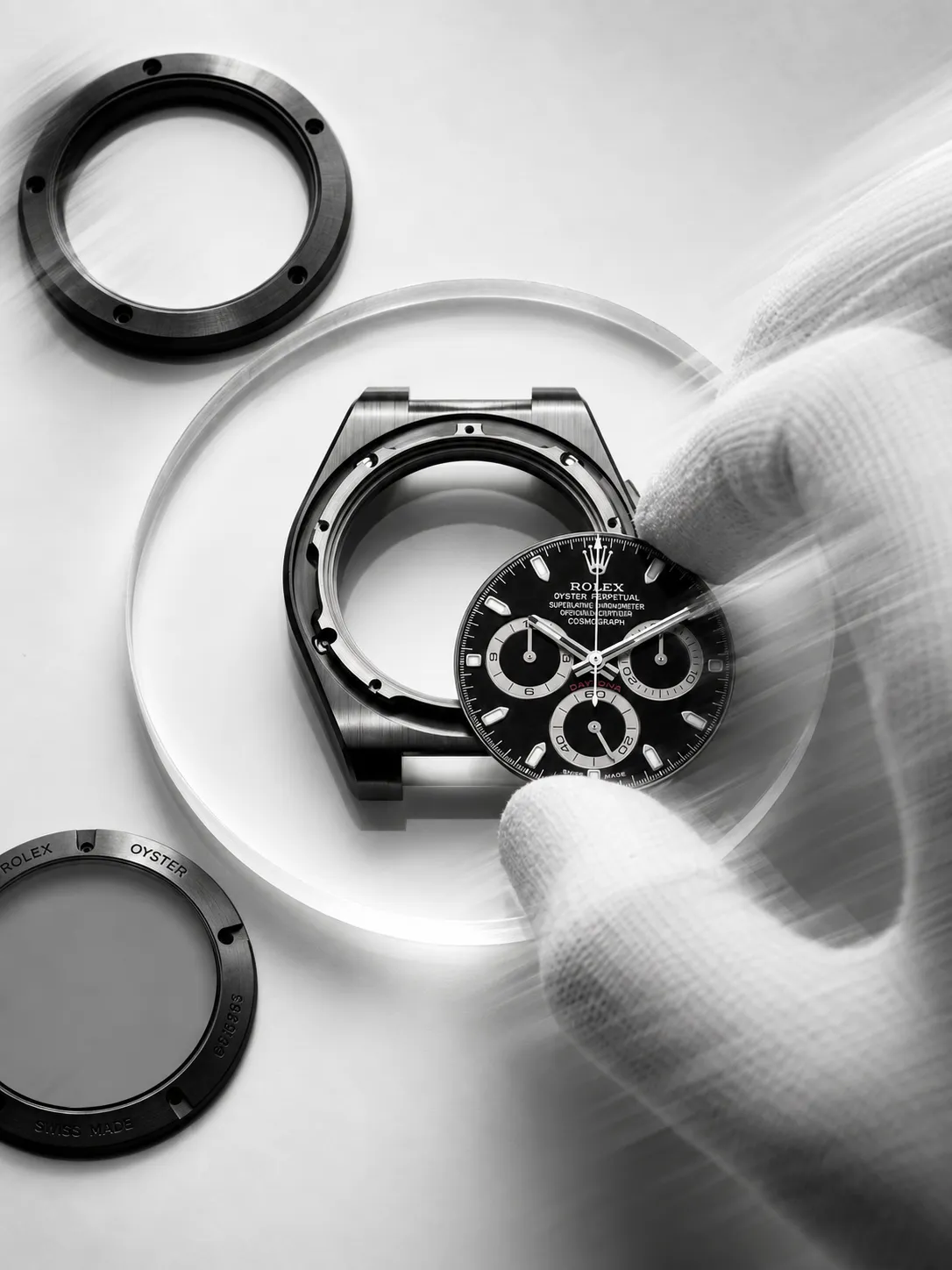 Watchmaker handling the dial of a disassembled Rolex watch